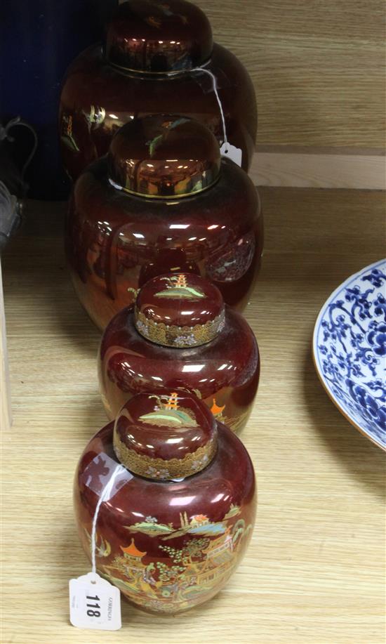 Two Carlton Ware Rouge Royale Pagoda ginger jars and covers and a smaller similar pair (one cover a.f.) H.27cm- tallest